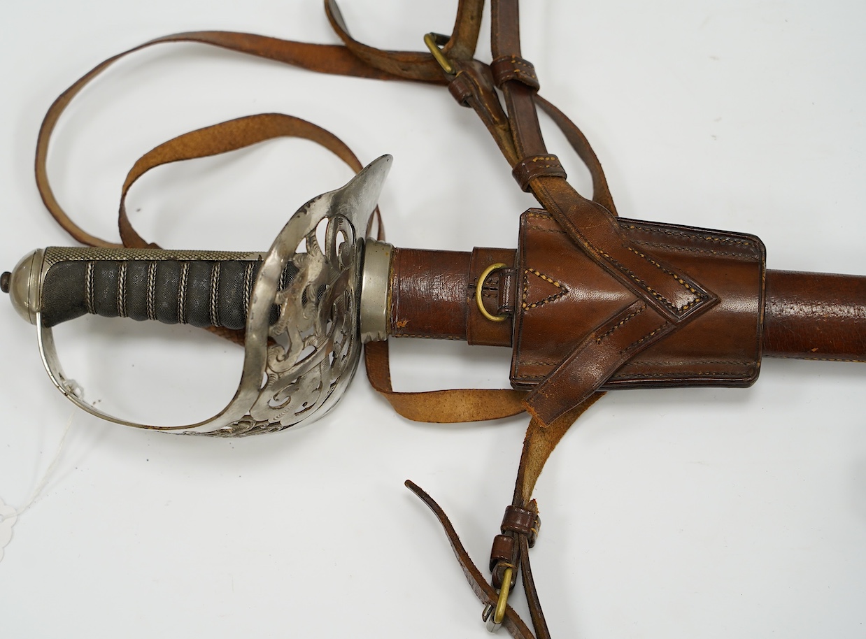 An 1895 pattern infantry officer’s sword by Wilkinson, proof number 34431, blade 82cm, in it’s leather field service scabbard with hangers and sword knot, with supporting research confirming that it was purchased by the